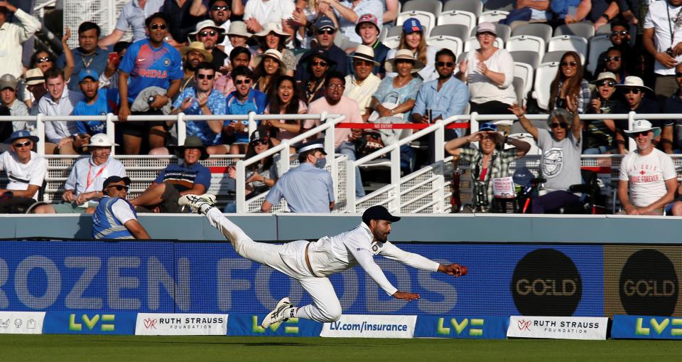 India's Ravindra Jadeja dievs to stop the ball hitting the boundary on the third day of the second cricket Test match  between England and India at Lord's cricket ground in London on August 14, 2021. - - RESTRICTED TO EDITORIAL USE. NO ASSOCIATION WITH DIRECT COMPETITOR OF SPONSOR, PARTNER, OR SUPPLIER OF THE ECB (Photo by Ian KINGTON / AFP) / RESTRICTED TO EDITORIAL USE. NO ASSOCIATION WITH DIRECT COMPETITOR OF SPONSOR, PARTNER, OR SUPPLIER OF THE ECB (Photo by IAN KINGTON/AFP via Getty Images)