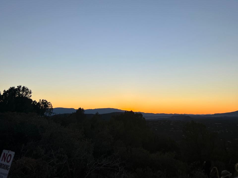 A scenic spot at sunset with the sky turning yellow to dark.