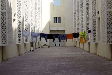 Laundry is seen hung out to dry outside an accommodation for migrant workers in Labor City, Qatar, January 13, 2016. REUTERS/Naseem Zeitoon/File Photo