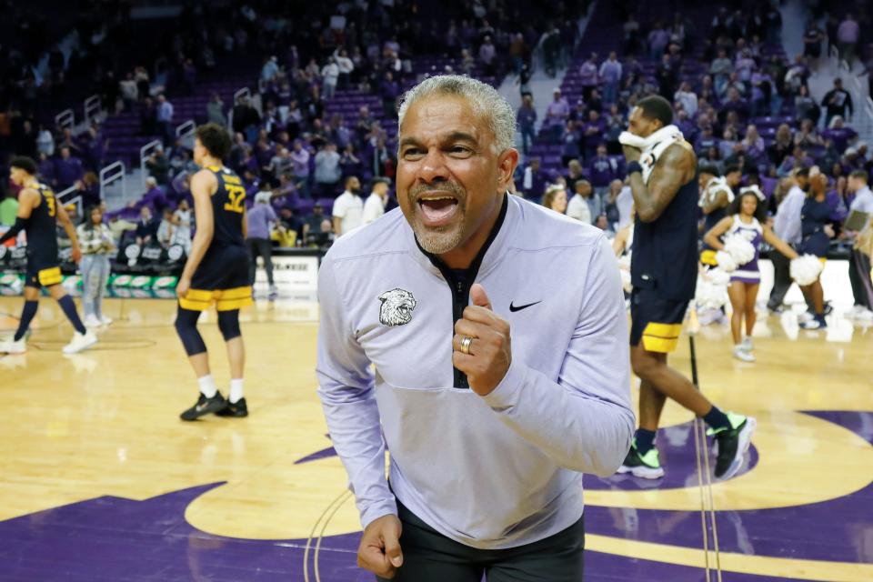 Kansas State head coach Jerome Tang dances on the court after his team's 82-76 overtime win over West Virginia at the end of an NCAA college basketball game, Saturday, Dec. 31, 2022, in Manhattan, Kan.