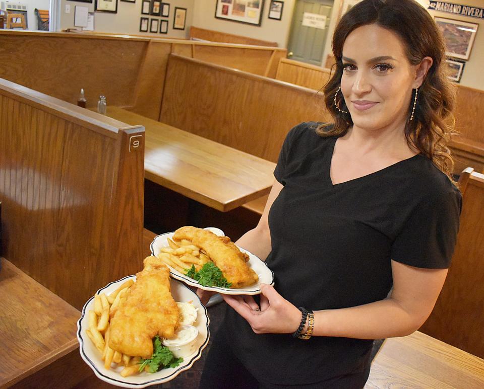 Patricia Lanni serves up fish and chips at the Liberal Club in Fall River, a family-owned eatery on Star St. The PBS show "Roadfood" filmed a segment there this past fall.