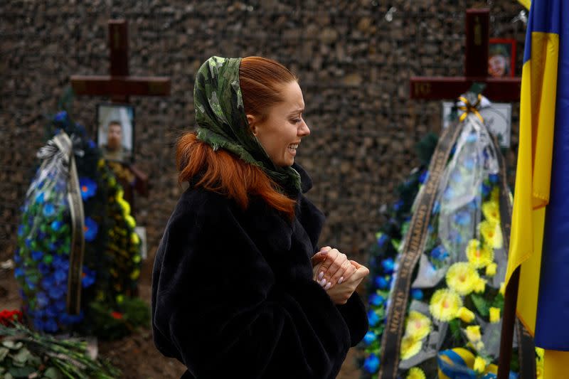 FILE PHOTO: Ukrainian actor Birzul visits grave af her younger brother Krotov in Kyiv