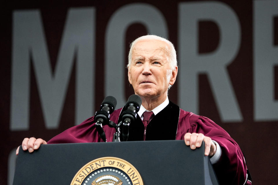 Joe Biden speaks at a podium (Alex Brandon / AP)