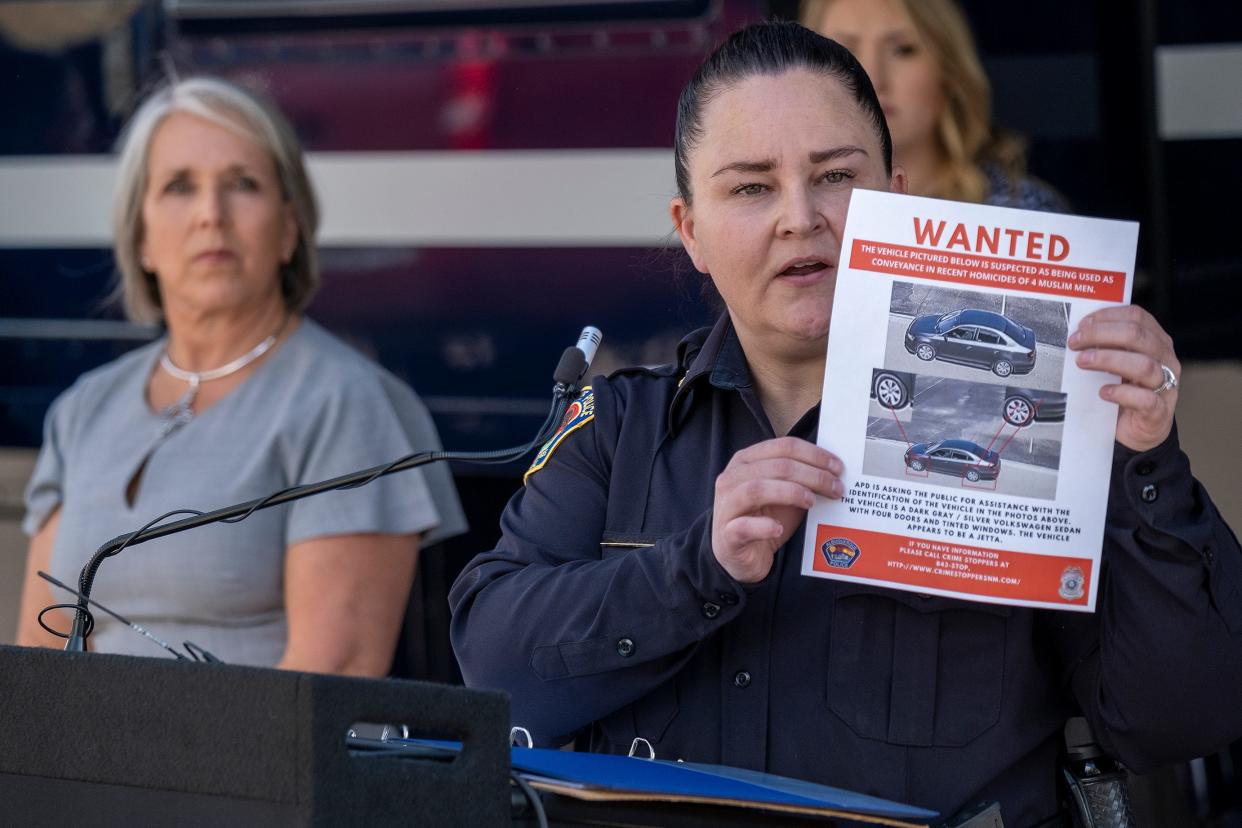 Cecily Barker, deputy chief of investigations with the Albuquerque Police Department, displays a flyer Aug. 7 with photos of a car that may have been used in connection with the murders of Muslim men in New Mexico.