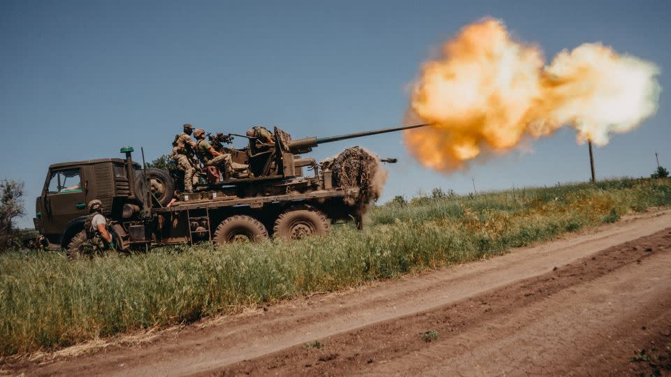 Ukrainian soldiers shoot rounds into Russian positions with an S60 anti-aircraft canon placed on a truck, outside Bakhmut. - Wojciech Grzedzinski/Anadolu Agency/Getty Images