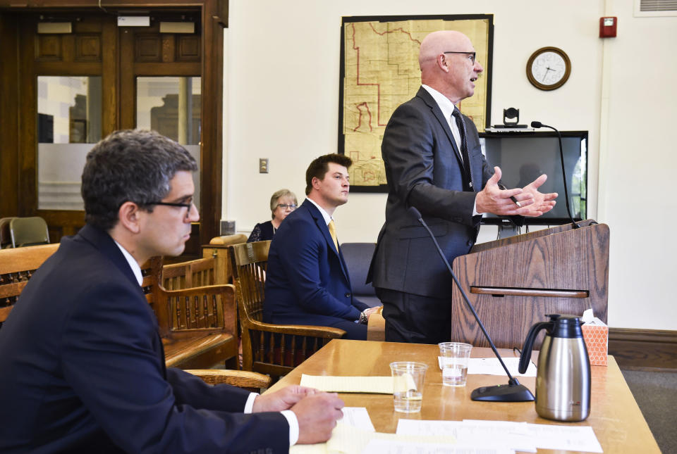 Jim Meloy, right, argues on behalf of Gov. Steve Bullock before Judge Mike McMahon over a disagreement between the governor and Secretary of State Corey Stapleton regarding the veto of a bill that defines a wild bison, Wednesday, June 5, 2019. (Thom Bridge/Independent Record via AP)