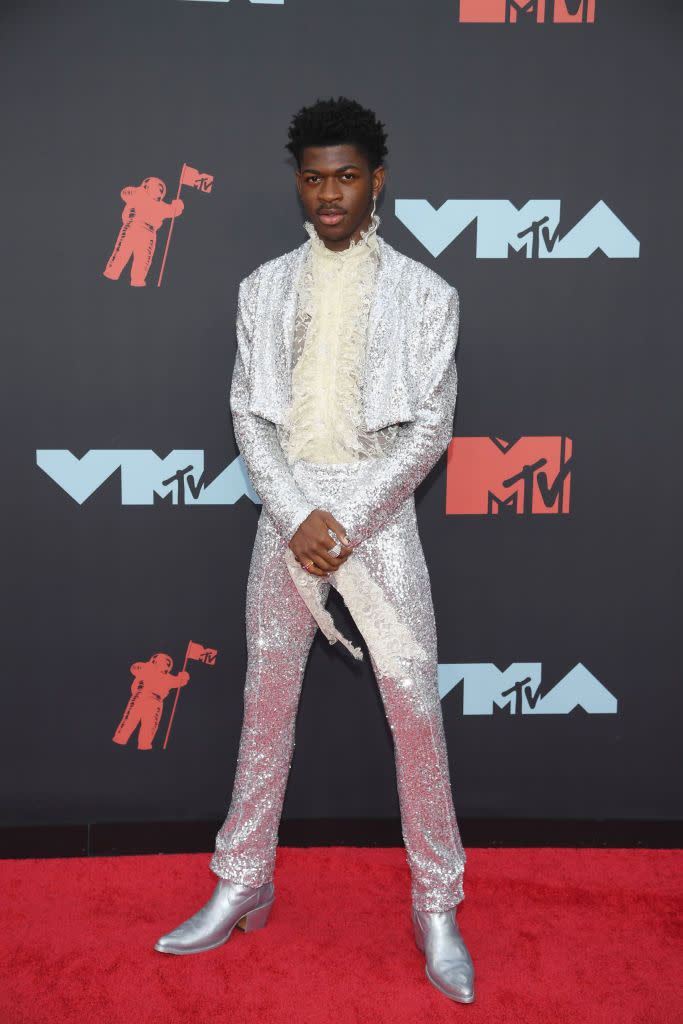 <p>He showed up to the VMAs looking flashier than the "Moon Man" trophy itself. This sequin Christian Cowan tuxedo was taken to the next level with a frilly white dress shirt. Very Prince-esque, no? </p>