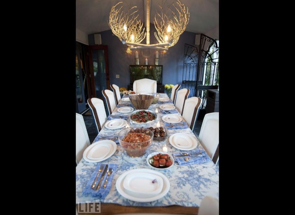 This Spanish-style dining room owned by a 30-year-old actress and new mom is brought to life by a branched chandelier. Find out whose home it is <a href="http://www.stylelist.com/2011/09/30/jessica-alba-at-home_n_989123.html#s384202" target="_hplink">here</a>.     Photo by Jeff Vespa for Life.