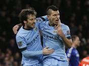 Manchester City's David Silva (L) celebrates his goal with teammate Sergio Aguero during their English Premier League soccer match against Chelsea at Stamford Bridge in London January 31, 2015. REUTERS/Stefan Wermuth