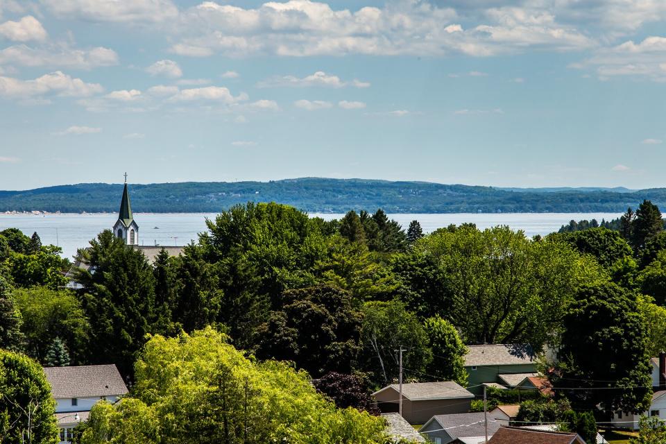 Shot from the road overlooking the city of Harbor Springs, Michigan, with water in the background.