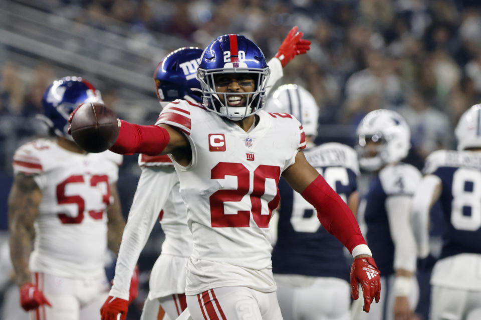 New York Giants safety Julian Love (20) celebrates after intercepting a pass against the Dallas Cowboys during the first half of an NFL football game Thursday, Nov. 24, 2022, in Arlington, Texas. (AP Photo/Michael Ainsworth)