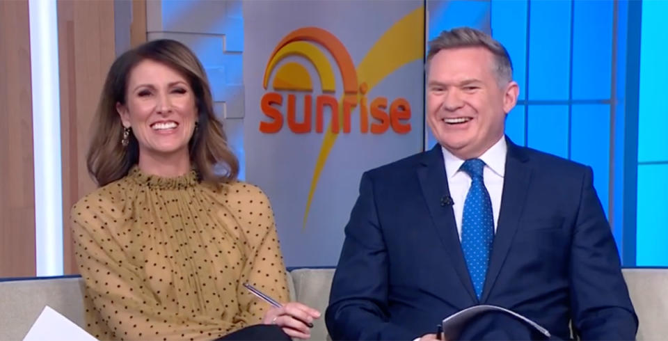 Sunrise host Nat Barr laughs with Michael Usher on set