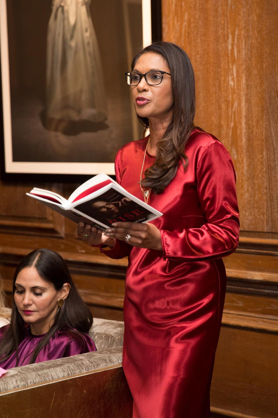 Gina Miller reads an extract from her book 
 Rise at Catherine Quin’s Women of Grace Literary Tea at Maison Assouline