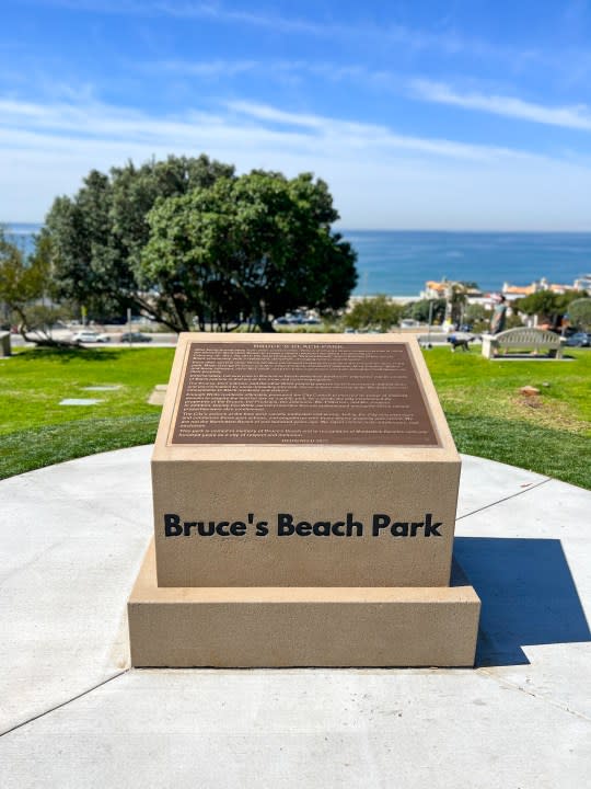A bronze plaque detailing the significant cultural history of Bruce's Beach Park in Manhattan Beach, California. (Manhattan Beach Police Department)