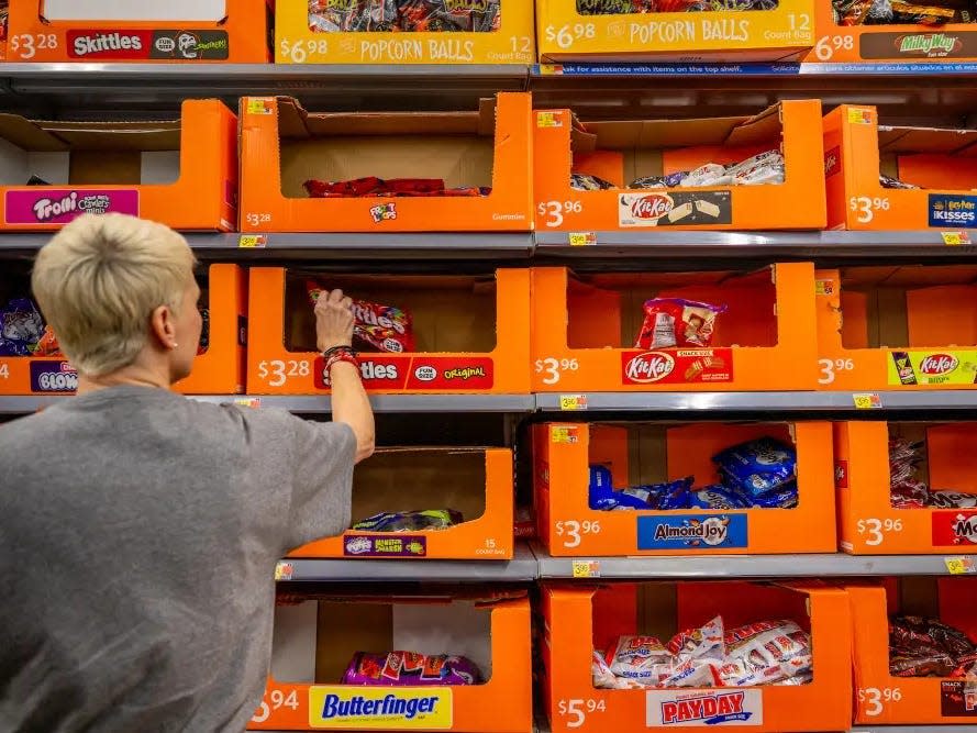 a customer shops for halloween candy