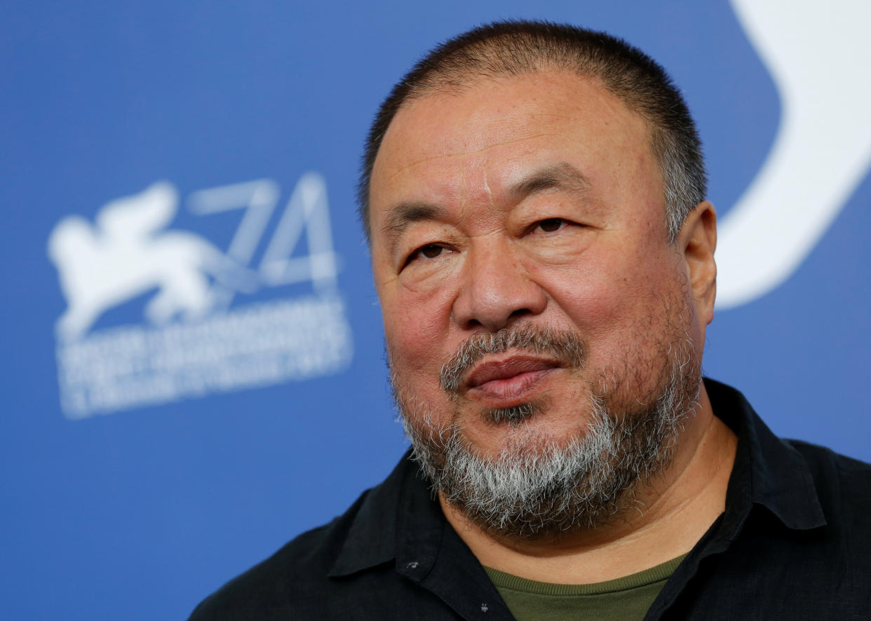 Ai Weiwei poses during a photo call for his documentary, "Human Flow," at the Venice Film Festival. Sept. 1. (Photo: Alessandro Bianchi / Reuters)