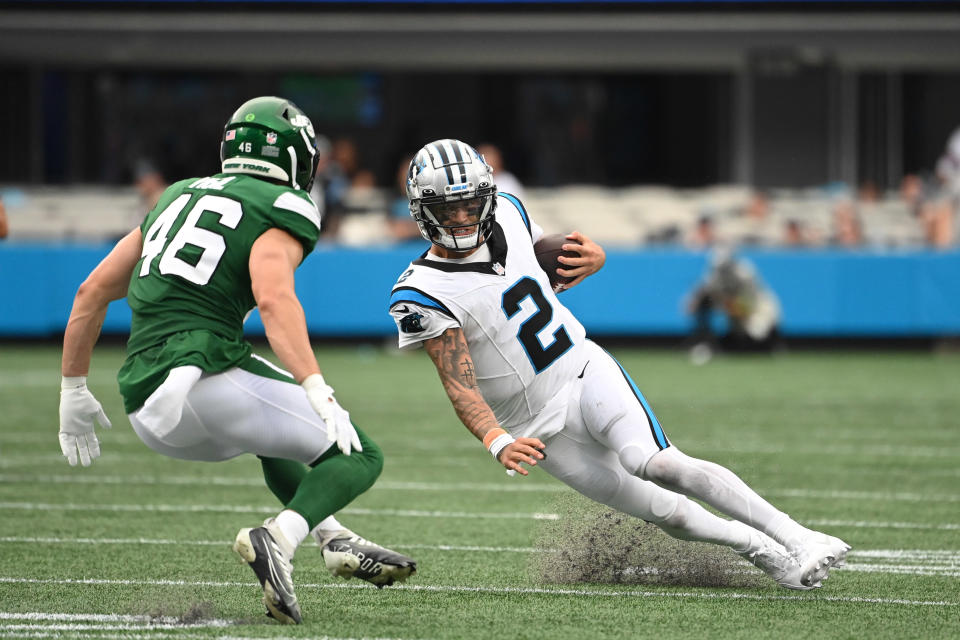 Aug 12, 2023; Charlotte, North Carolina, USA; Carolina Panthers quarterback Matt Corral (2) slides as New York Jets linebacker Maalik Hall (46) defends in the fourth quarter at Bank of America Stadium. Mandatory Credit: Bob Donnan-USA TODAY Sports