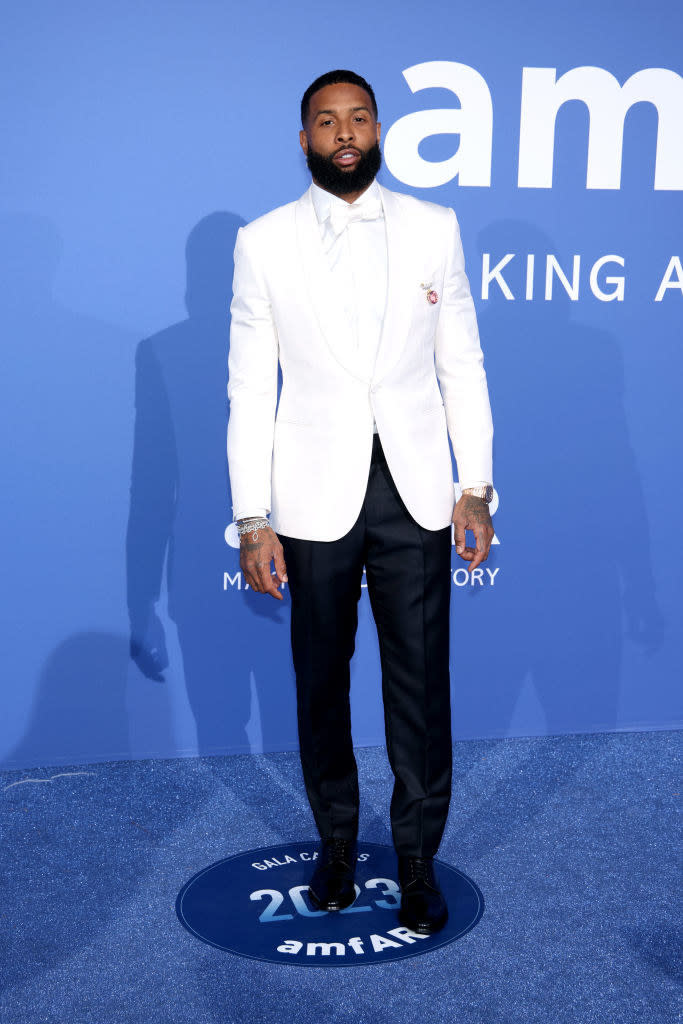 Odell is wearing a tailored tuxedo