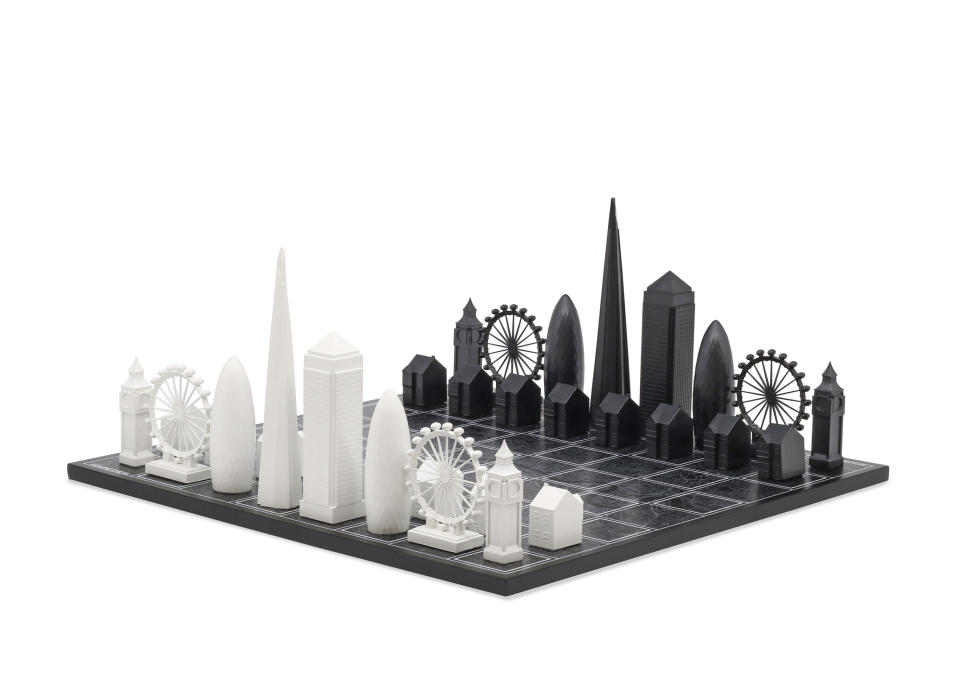 This image provided by Skyline Chess shows a chess set with pieces as iconic skyline buildings. Splurge on Skyline Chess' sets of iconic cities, including London, Tokyo, New York and Los Angeles, in stainless steel, acrylic or bronze. New York, for instance, with One World Trade Tower and the Empire State building as king and queen, might face off against Chicago, with the Willis Tower and the John Hancock Centre as the royal couple. (Skyline Chess via AP)