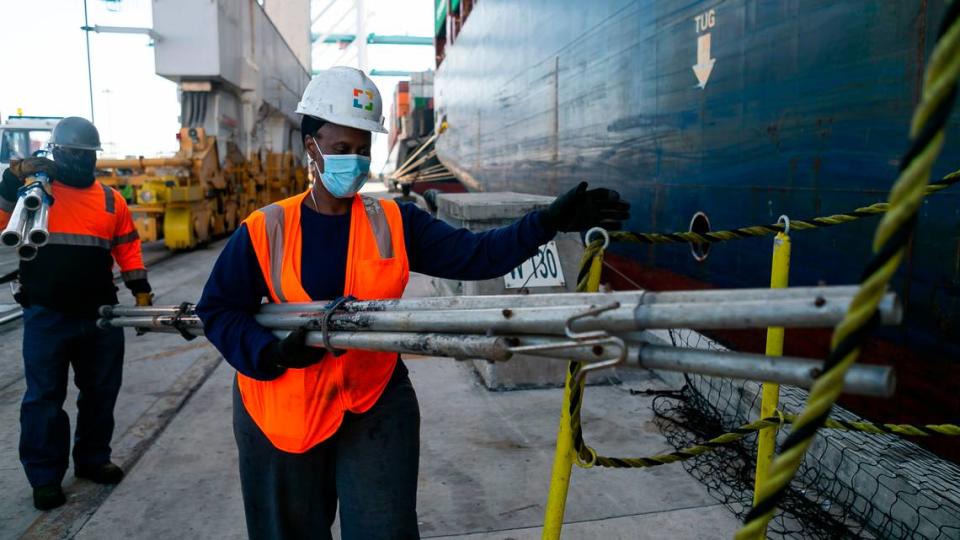 Longshorewoman Eunice Adams makes her way onto a cargo ship at PortMiami on Saturday, February 20, 2021. Adams has been working as a longshorewoman for 30 years.