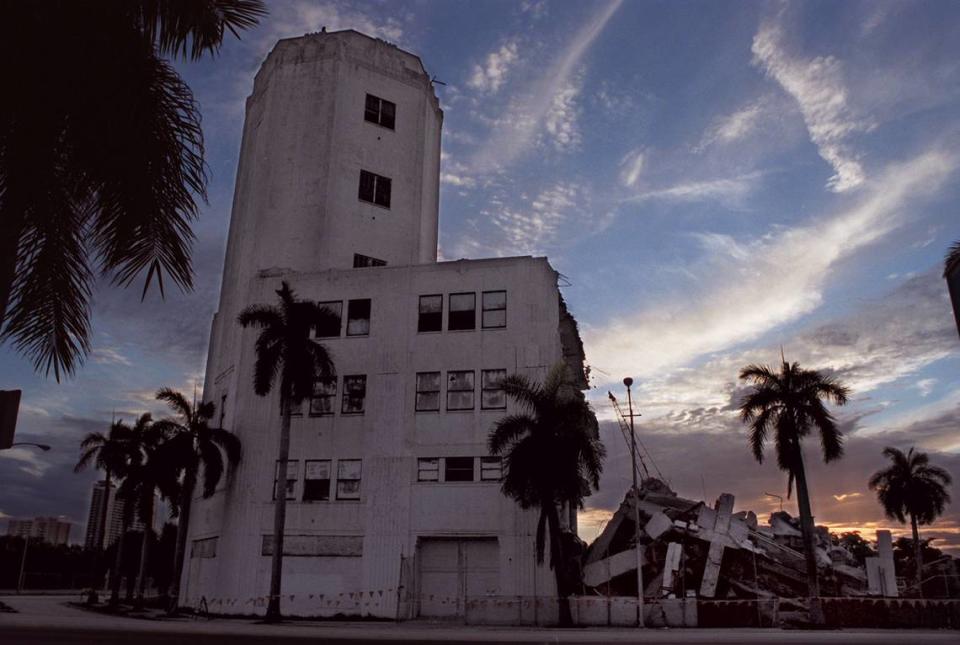 In this 2001 file photo, the Sears Tower in downtown Miami remains standing as demolition continues, making way for the future performing arts center on Biscayne Boulevard.