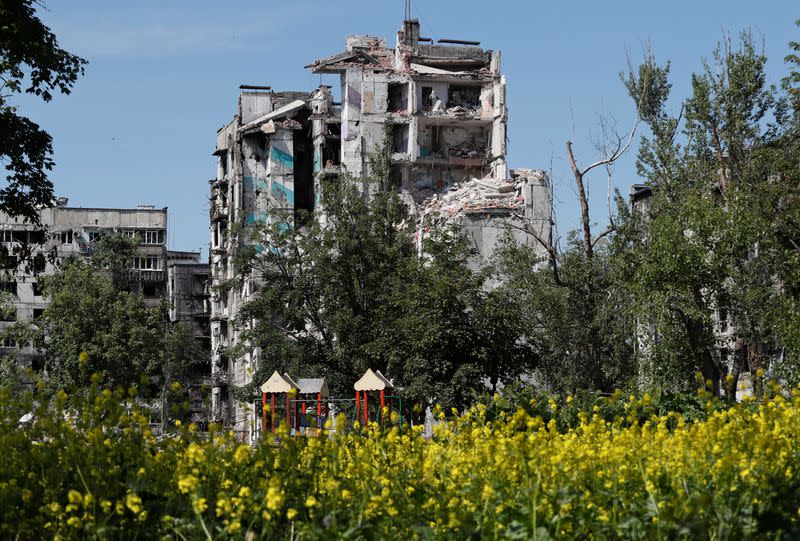 A view shows a heavily damaged residential building in Mariupol