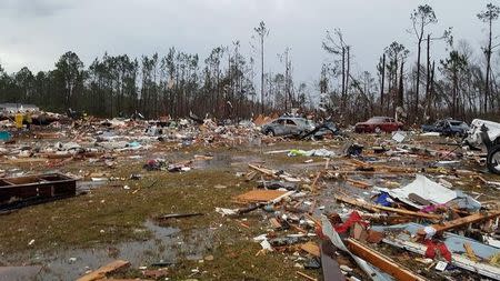 Debris covers an area of the Sunshine Acres neighborhood after a tornado struck Adel, Georgia, U.S. January 22, 2017. Courtesy of Nathaniel Sixberry/Handout via Reuters