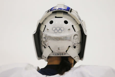 South Korean women's ice hockey goaltender So Jung Shin wears a helmet with the Olympics rings ahead of the South Korea Winter Olympics, during practice in Hamden, Connecticut, U.S., December 27, 2017. Picture taken December 27, 2017. REUTERS/Brian Snyder