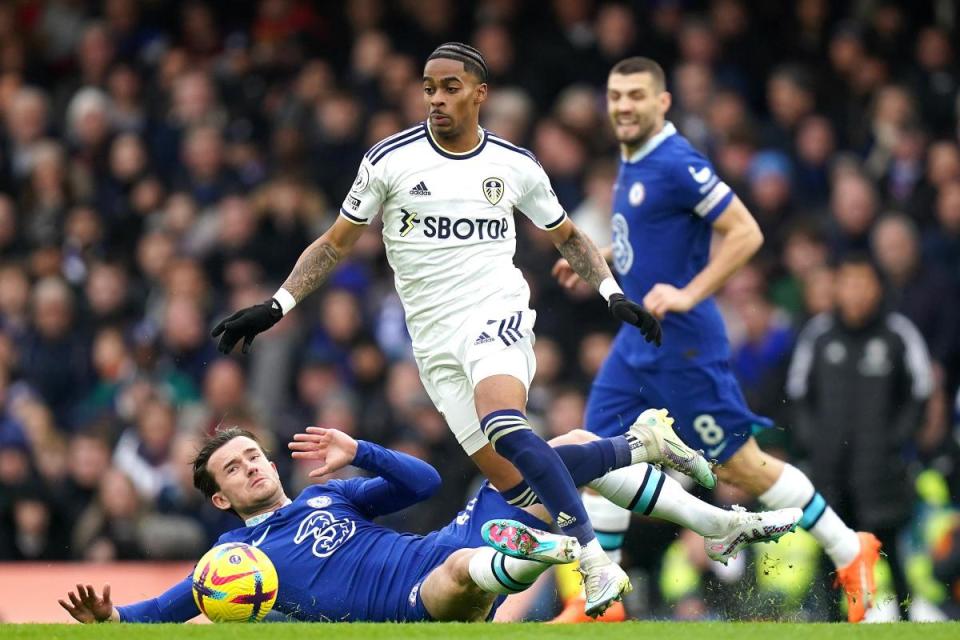 Leeds United's Crysencio Summerville is tackled by Chelsea's Ben Chilwell (left) during the Premier League match at Stamford Bridge, London. Picture date: Saturday March 4, 2023 <i>(Image: PA/Adam Davy)</i>