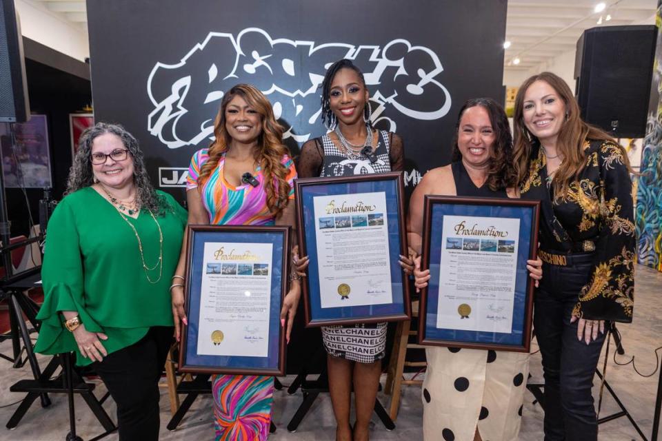 (From left to right) Miami-Dade County Department of Cultural Affairs director Marialaura Leslie, Supa Cindy, Stichiz, Lucy Lopez and Allison Freiden at The Art of Hip Hop on March 15. Supa Cindy, Stichiz and Lucy Lopez were presented with proclamations from Miami-Dade County in honor of their work as local radio hosts. World Red Eye/Courtesy of The Art of Hip Hop