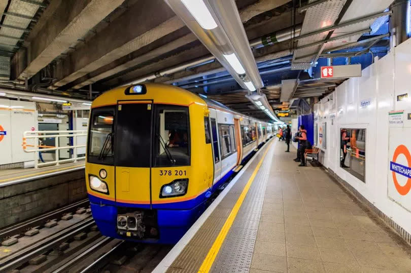 A London Overground train pulling into Whitechapel station in East London