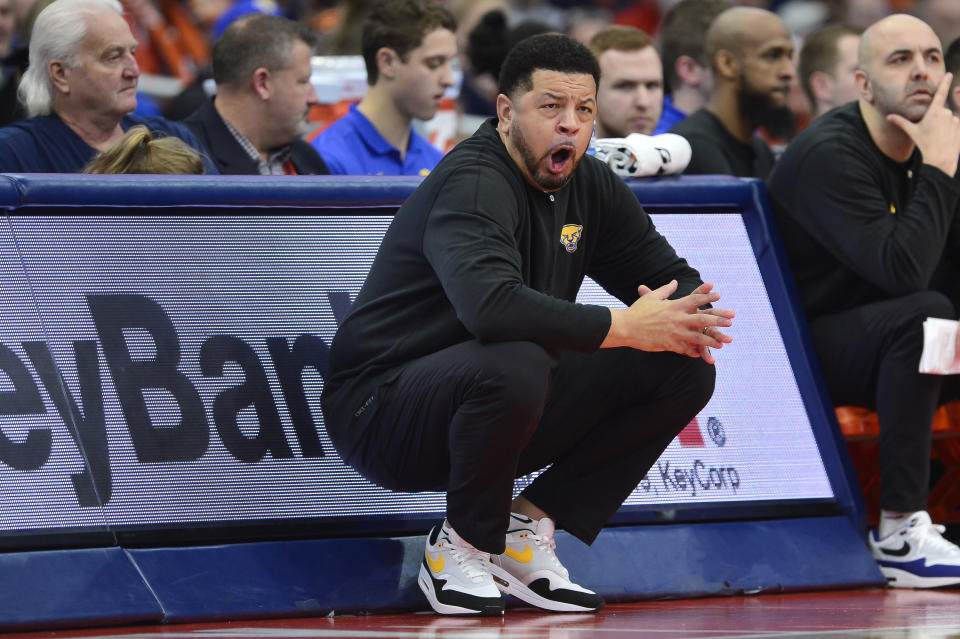 Pittsburgh head coach Jeff Capel yells to his players during the first half of an NCAA college basketball game against Syracuse in Syracuse, N.Y., Saturday, Dec. 30, 2023. (AP Photo/Adrian Kraus)