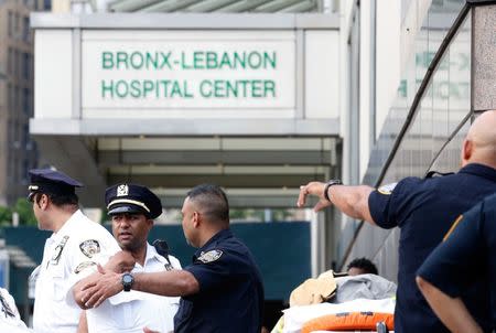 Police officers patrol the scene after an incident in which a gunman fired shots inside the Bronx-Lebanon Hospital in New York City, U.S. June 30, 2017. REUTERS/Brendan Mcdermid