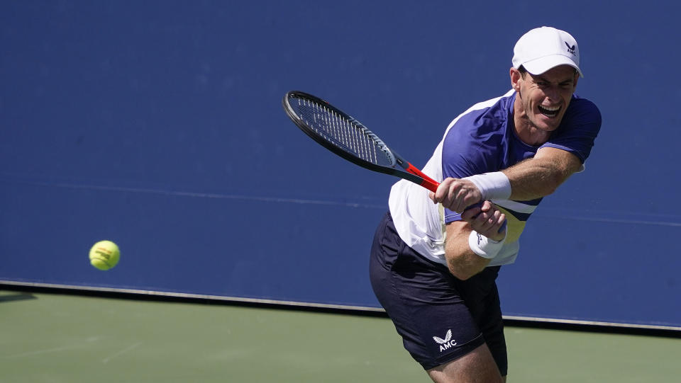 Andy Murray, of Great Britain, returns a shot to Francisco Cerundolo, of Argentina, during the first round of the US Open tennis championships, Monday, Aug. 29, 2022, in New York. (AP Photo/Seth Wenig)