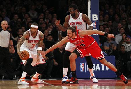 Dec 11, 2013; New York, NY, USA; New York Knicks power forward Kenyon Martin (3) grabs a loose ball away from Chicago Bulls center Joakim Noah (13) in the second half of NBA game at Madison Square Garden. Noah K. Murray-USA TODAY Sports