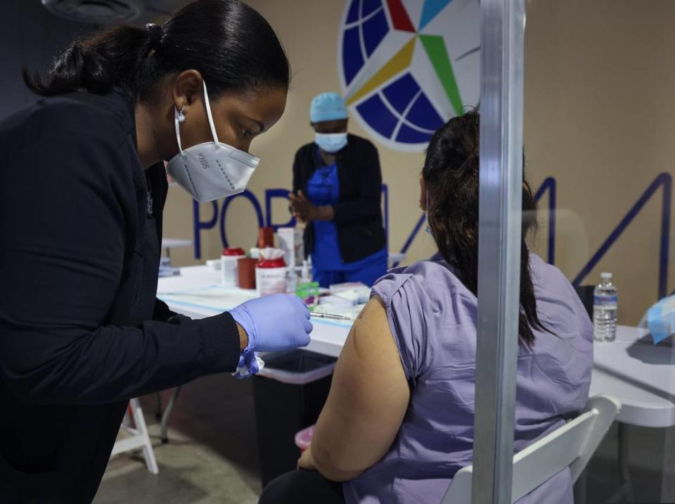 A nurse administers the Pfizer vaccine at the Florida Division of Emergency Management COVID-19 vaccination site at Terminal J at PortMiami on May 12, 2021.