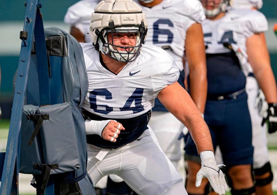 Penn State offensive lineman Hunter Nourzad runs a drill during practice on Wednesday, Aug. 10, 2022.