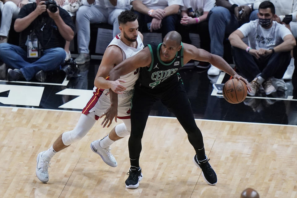 Miami Heat guard Max Strus (31) defends Boston Celtics center Al Horford (42) during the first half of Game 5 of the NBA basketball Eastern Conference finals playoff series, Wednesday, May 25, 2022, in Miami. (AP Photo/Wilfredo Lee)