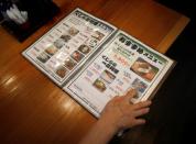 A menu featuring whale meat dishes are seen at a restaurant P-man in Minamiboso