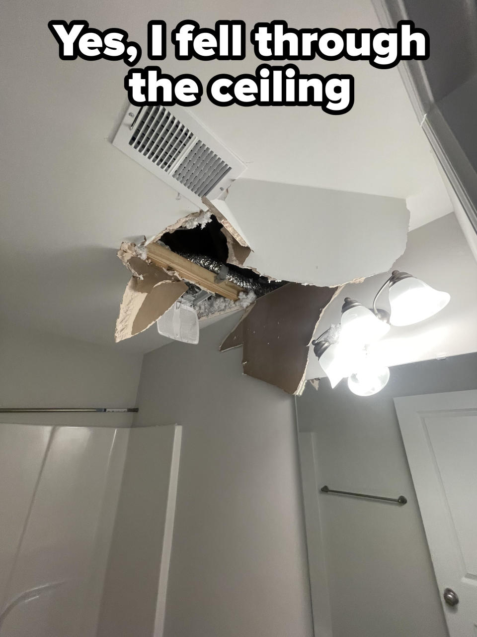 A huge hole in the ceiling with "Yes, I fell through the ceiling" caption