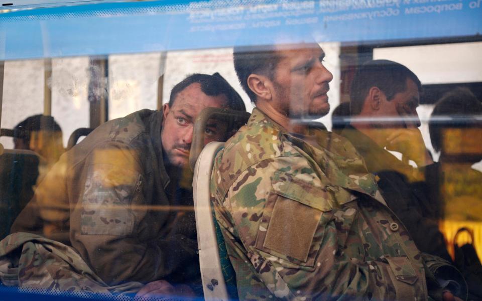 Ukrainian servicemen sit in a bus after they were evacuated from the besieged Mariupol's Azovstal steel plant - Alexei Alexandrov /AP