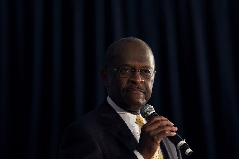 FILE PHOTO: U.S. Republican presidential candidate Herman Cain speaks at a town hall event in Rock Hill, South Carolina