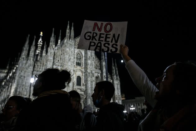 People protest against the so-called Green Pass on Piazza Duomo in Milan on October 16, 2021 as all workers must show since October 15 a so-called Green Pass, offering proof of vaccination, recent recovery from Covid-19 or a negative test, or face being declared absent without pay. (Photo by Piero CRUCIATTI / AFP) (Photo by PIERO CRUCIATTI/AFP via Getty Images) (Photo: PIERO CRUCIATTI via Getty Images)