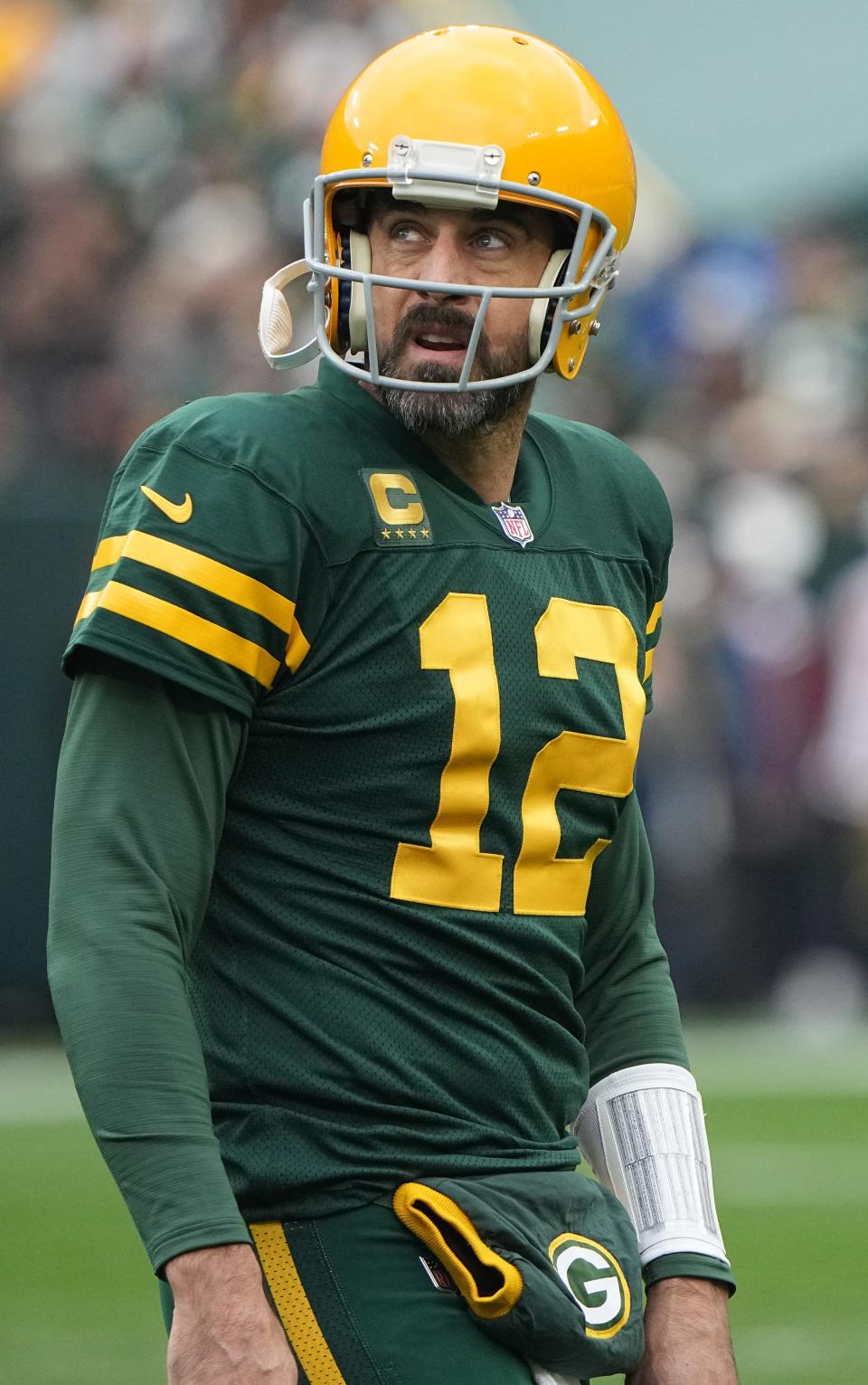 Aaron Rodgers walks off the field after throwing an incomplete pass against the New York Jets on Oct. 16, 2022.