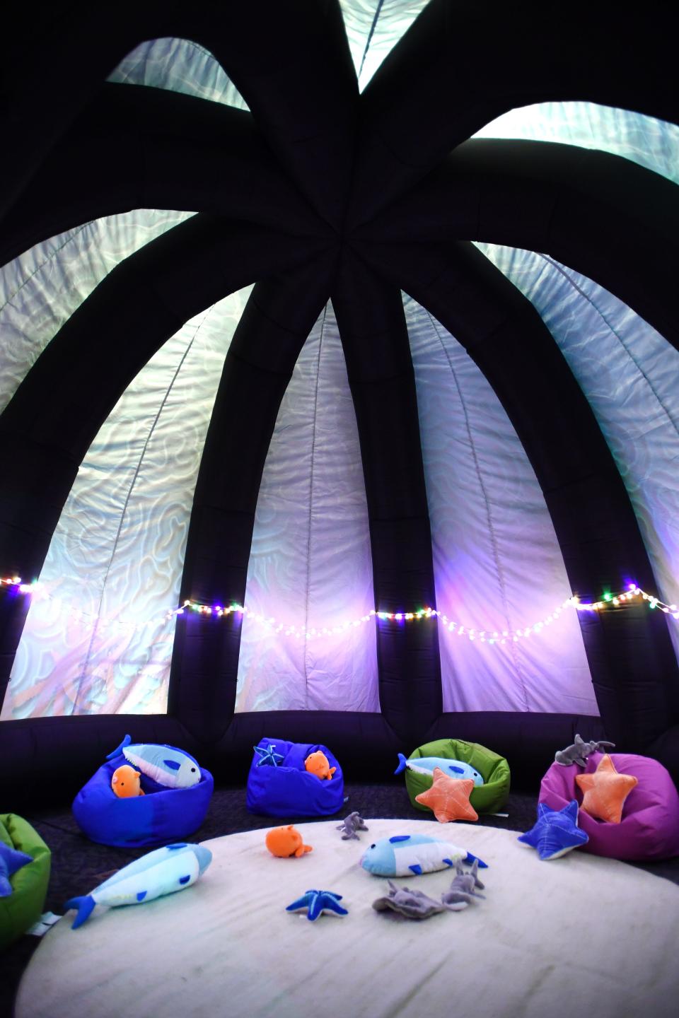 A giant inflatable coral includes a soft play area.