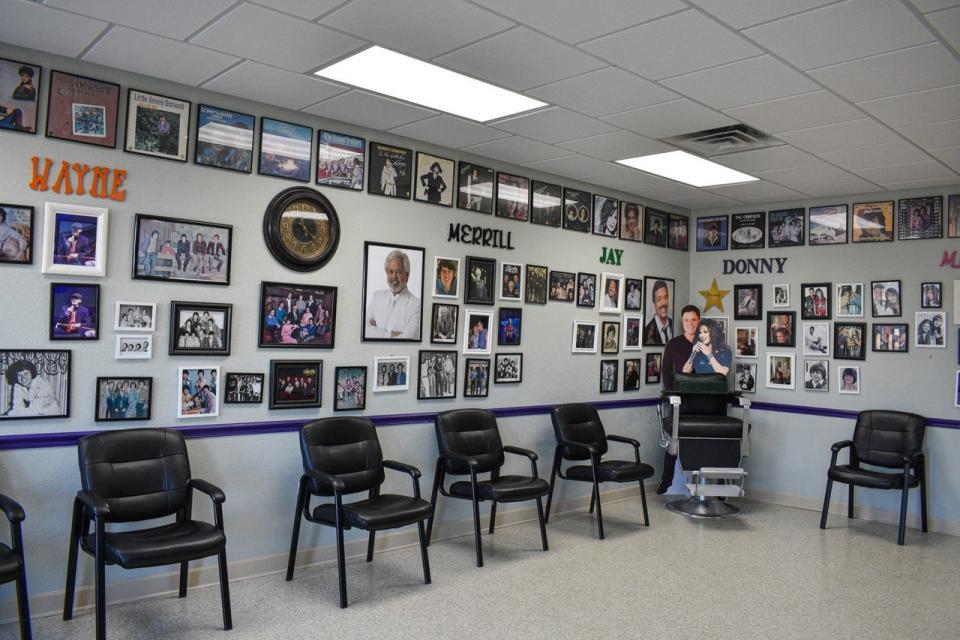 The Village Barbershop is decorated with dozens of photos of family singing group, the Osmonds.