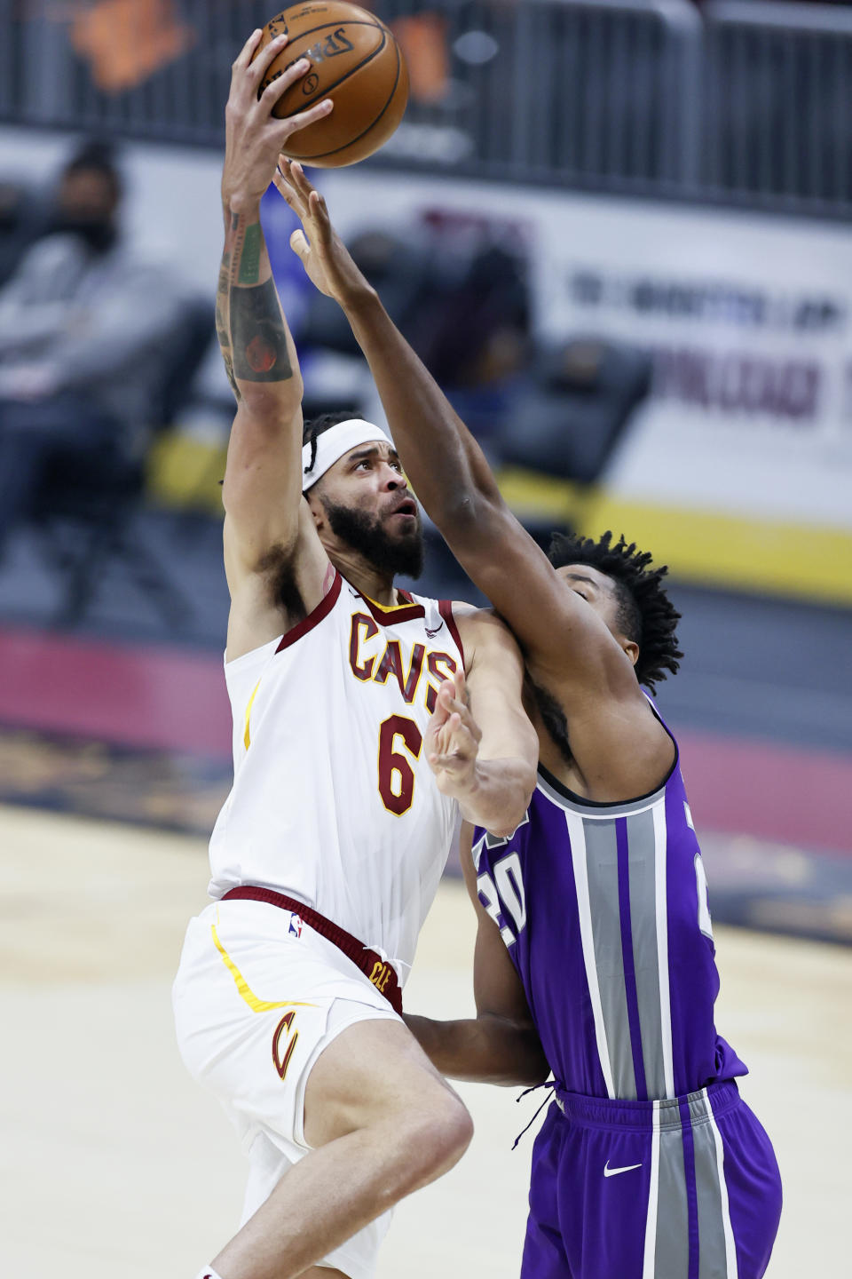 Cleveland Cavaliers' JaVale McGee (6) shoots against Sacramento Kings' Hassan Whiteside (20) in the first half of an NBA basketball game, Monday, March 22, 2021, in Cleveland. (AP Photo/Ron Schwane)