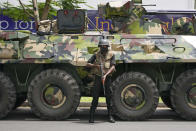 A Sri Lankan army soldier stands guard on a street in Colombo, Sri Lanka, Saturday, May 14, 2022. Protesters attacked earlier this week by supporters of Sri Lanka’s government are demanding that the newly appointed prime minister arrest his predecessor for allegedly instigating the attack against them as they called for his resignation. (AP Photo/Eranga Jayawardena)