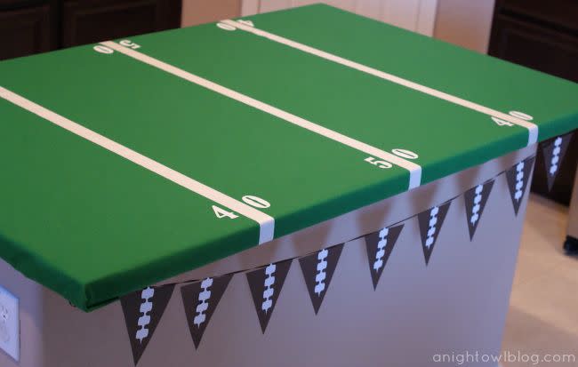 <p>Transform your table into a football field with this tablecloth. Made of green felt and white duct tape, it'll easily take your party decorations to the next level and make cleaning up a lot easier.</p><p><em><a href="https://www.anightowlblog.com/easy-football-field-party-table/" rel="nofollow noopener" target="_blank" data-ylk="slk:Get the tutorial at A Night Owl Blog »;elm:context_link;itc:0;sec:content-canvas" class="link ">Get the tutorial at A Night Owl Blog »</a></em> </p>