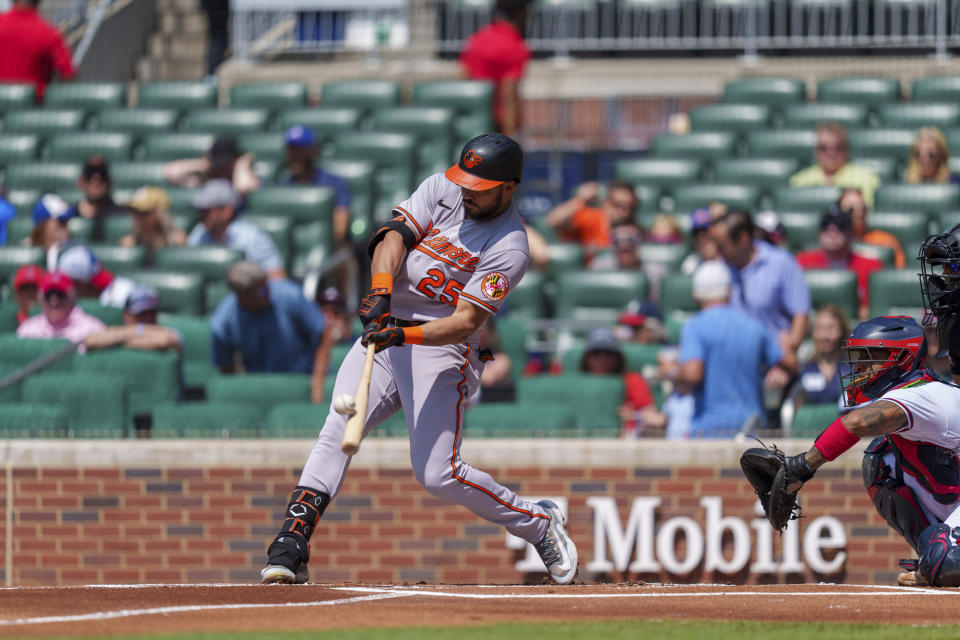 Baltimore Orioles' Anthony Santander hits the ball in the first inning of a baseball game against the Atlanta Braves on Sunday, May 7, 2023, in Atlanta. (AP Photo/Erik Rank)